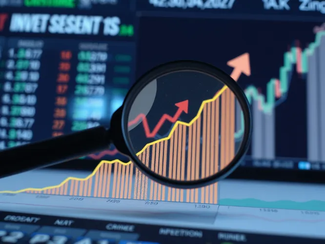 Investment growth chart with financial data and a magnifying glass